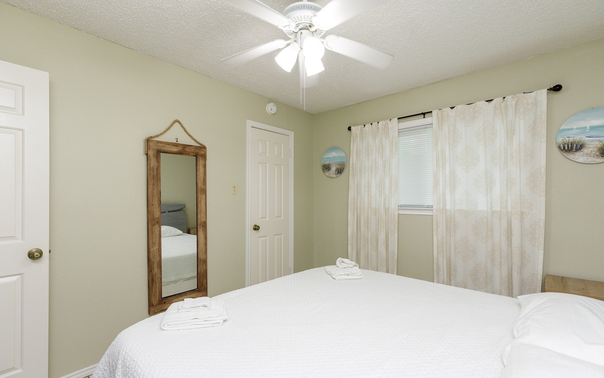 Drift off peacefully in your serene bedroom with a king size bed.