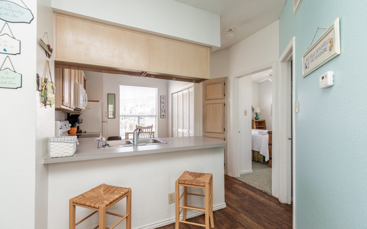Your fully-equipped kitchen makes morning coffee and evening meals a breeze, with bar seating perfect for casual dining.