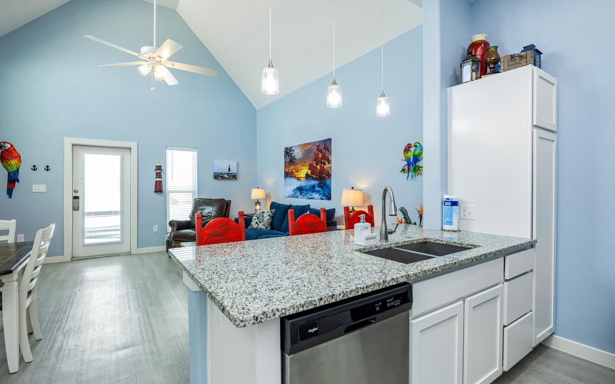 Your open-concept kitchen flows seamlessly into the living space, perfect for preparing meals while staying connected with family and friends.
