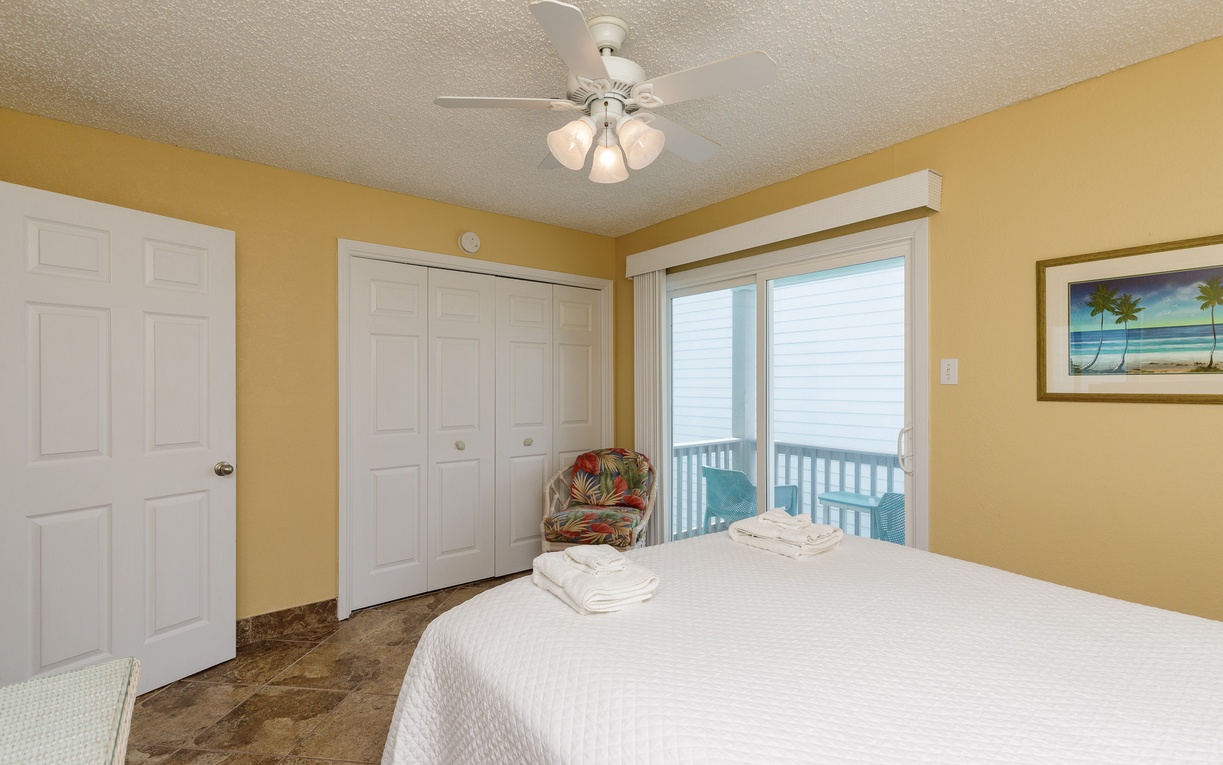 Second floor guest bedroom with queen size bed.