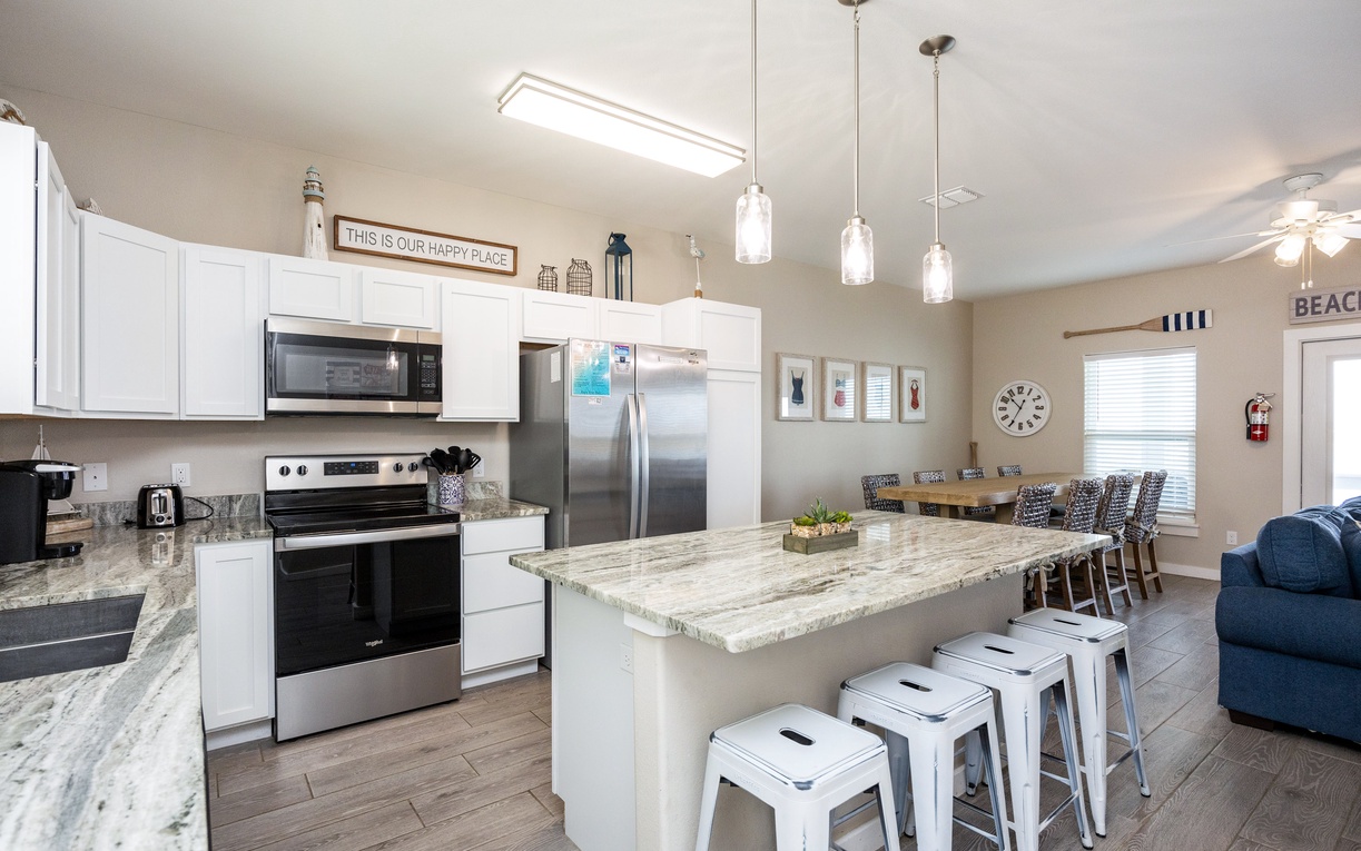 Gather around your spacious kitchen island with granite counters and modern appliances, perfect for memorable meals together.