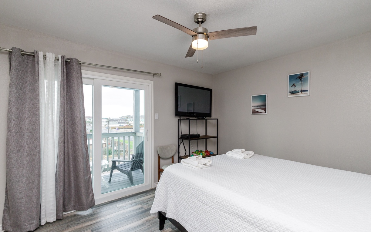 Unwind in your peaceful bedroom featuring crisp linens and private balcony access for fresh morning air.