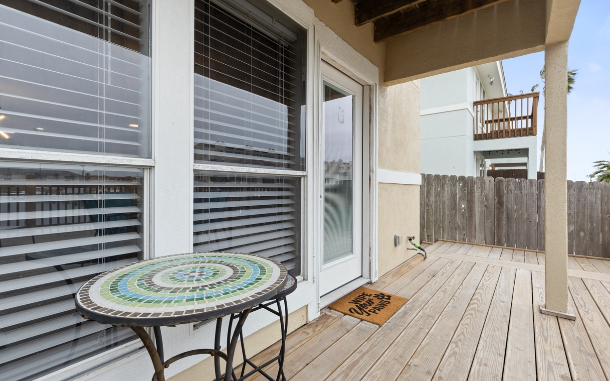 Step onto your private deck with charming mosaic table - perfect for morning coffee or evening relaxation in your own outdoor sanctuary.