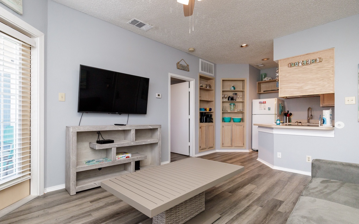 Relax in your bright open-concept living space with modern kitchen and cozy seating area perfect for unwinding.