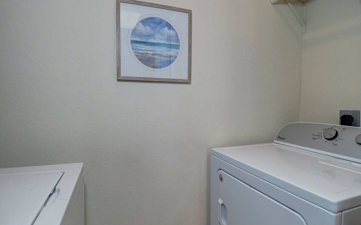 Your private laundry room keeps your beach vacation wardrobe fresh, with convenient shelving for all your detergents and essentials.