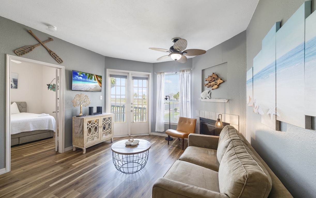 Sink into the plush sleeper sofa as coastal breezes flow through your bright living space, complete with fireplace warmth and stylish nautical touches.