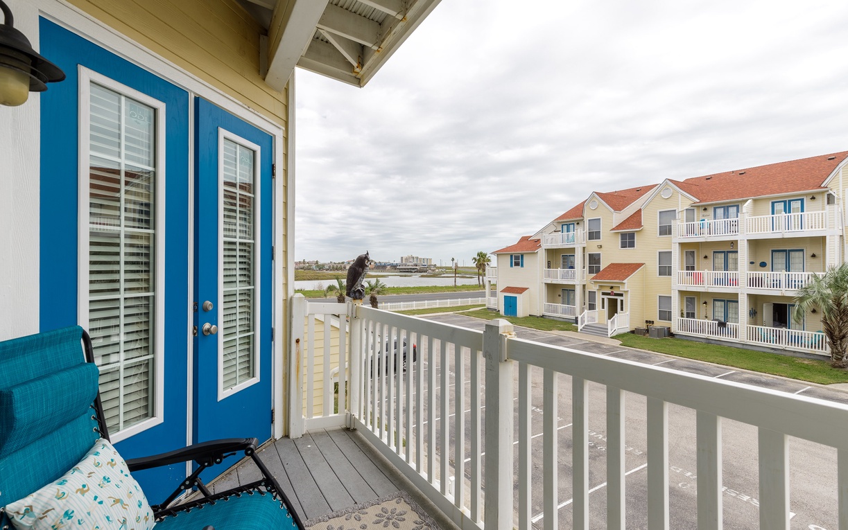 Step onto your private balcony and breathe in the coastal air while your cat enjoys the view of neighboring vacation homes.