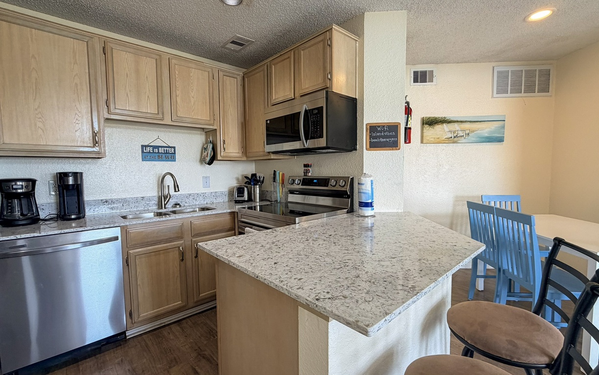 Your fully equipped kitchen awaits with granite counters, stainless appliances, and everything needed to create memorable meals during your stay.