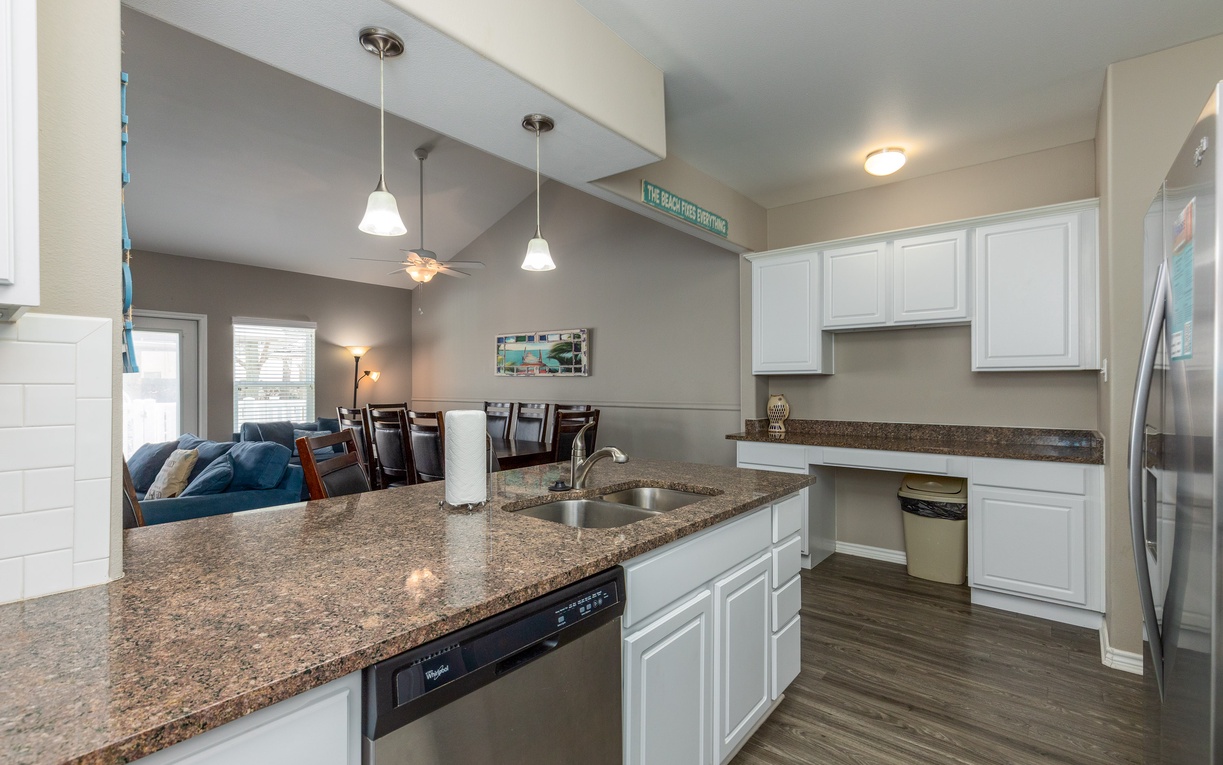 Your open-plan kitchen flows seamlessly into the dining area, creating the perfect space for cooking memorable meals together.