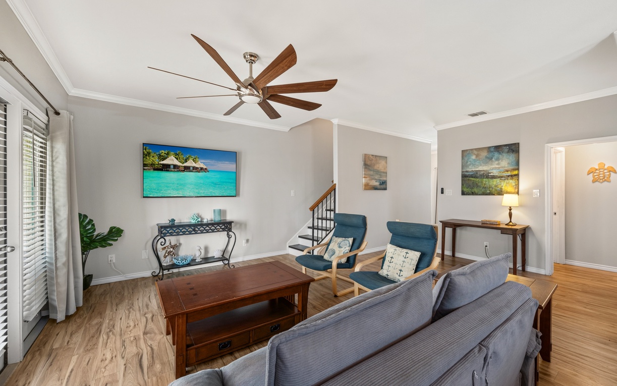 Settle into your comfortable living room with stylish furnishings and a soothing coastal color palette. The ceiling fan keeps you cool while you relax after your day's adventures.