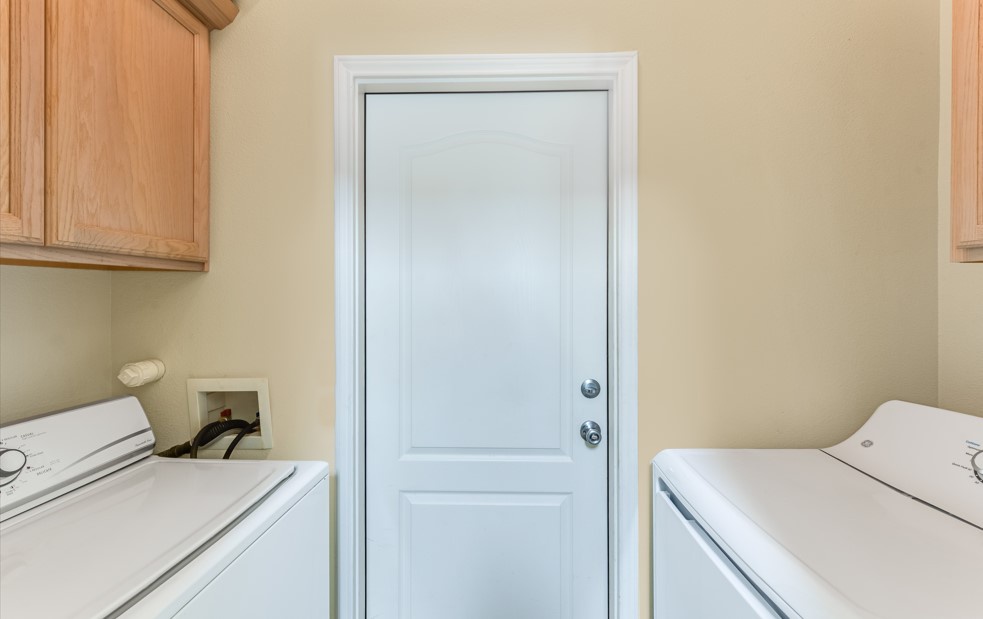 Your dedicated laundry room features side-by-side washer and dryer with convenient overhead storage for all your vacation essentials.