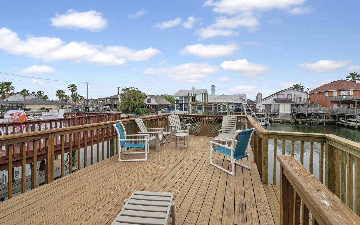 Relax on your private waterfront deck with comfortable seating while enjoying stunning canal views and coastal neighborhood charm.