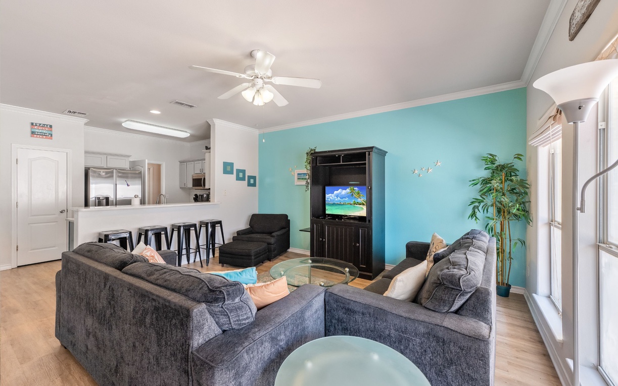 Sink into plush sectional seating while enjoying coastal colors and modern comfort in your spacious living area.