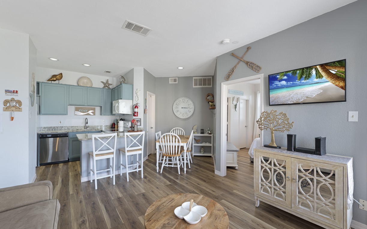 Your bright, coastal-themed retreat features turquoise cabinets and nautical touches that make you feel instantly at home.