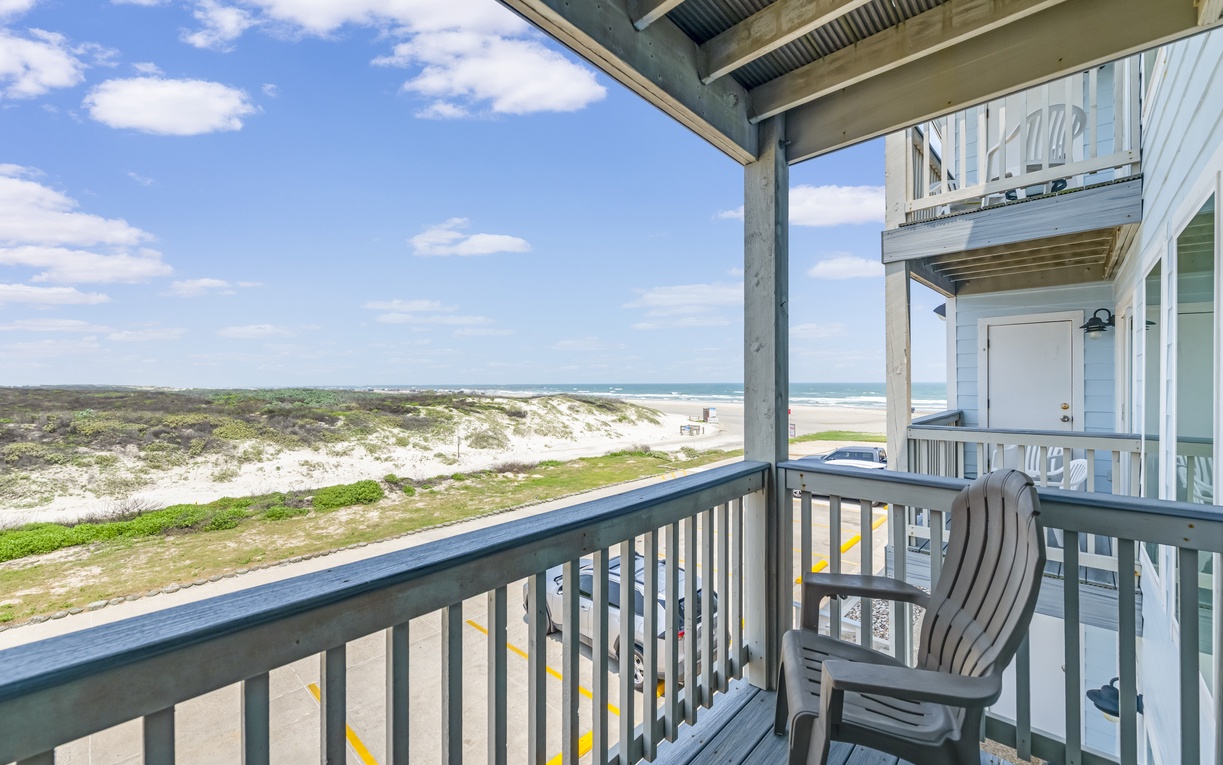 Unwind on your private balcony overlooking serene coastal dunes and sparkling ocean waves, perfect for morning coffee or sunset moments by the sea.