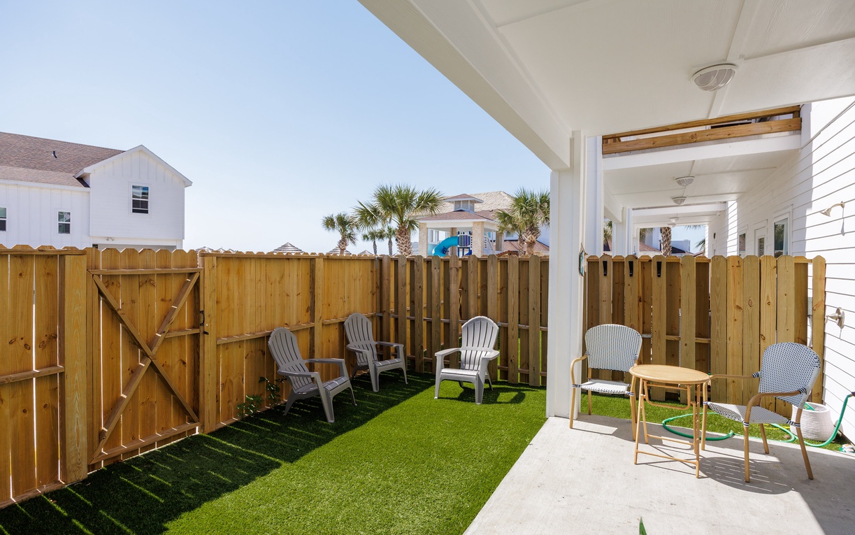 Your private patio offers the perfect spot to unwind with morning coffee or evening relaxation, complete with comfortable seating and lush artificial turf.