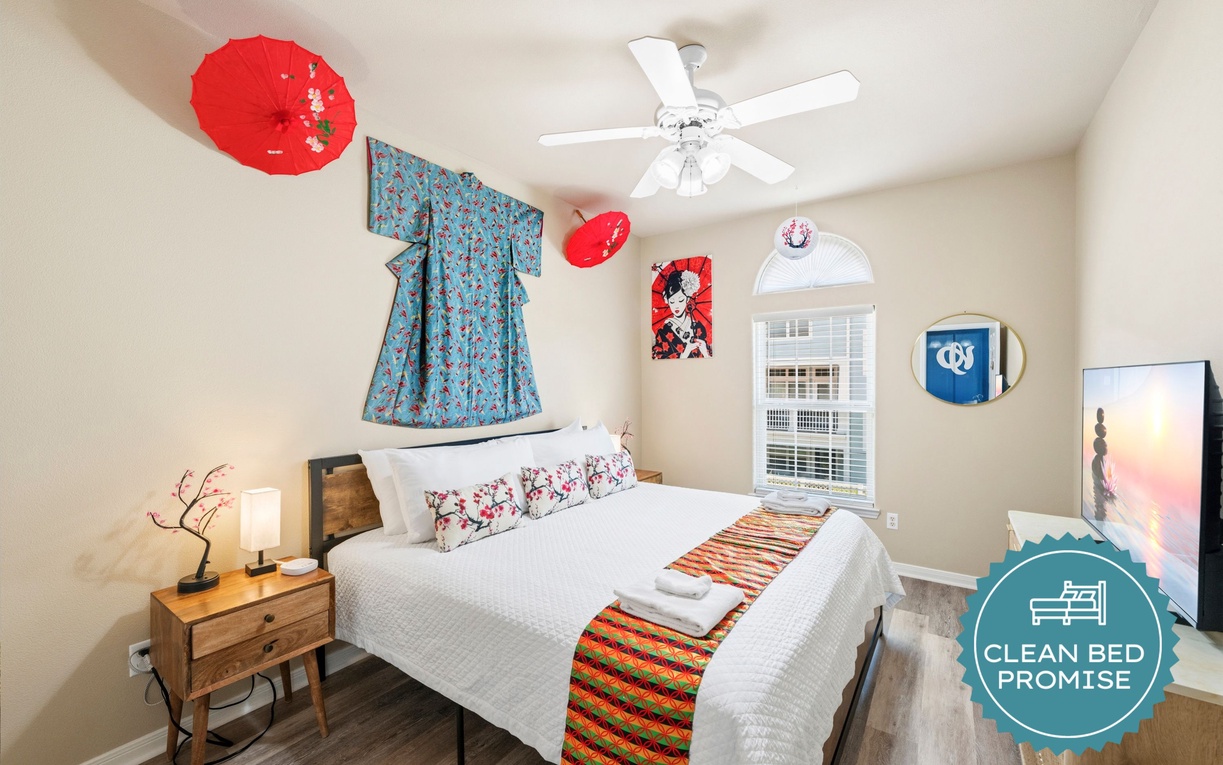 Your serene bedroom features a ceiling fan for comfort, fresh linens, and thoughtful cultural artwork that creates a welcoming, relaxing atmosphere for your stay.