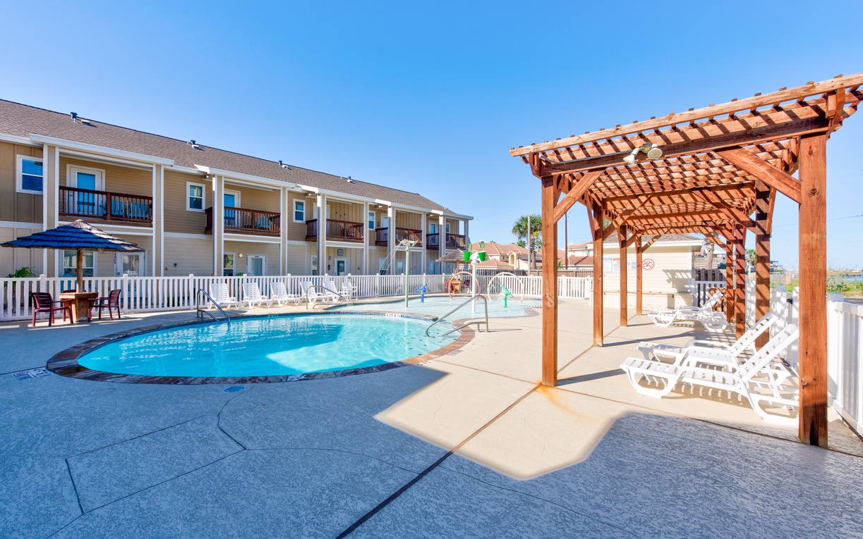 Take a refreshing dip in your sparkling pool, then unwind under the shaded pergola with stunning views of the property.