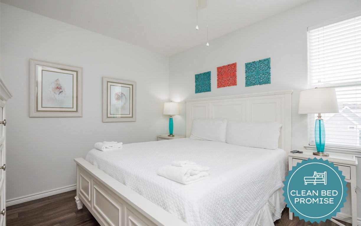 Drift off to sleep in your bright, airy bedroom with crisp linens and soothing coastal touches that make every morning feel fresh.
