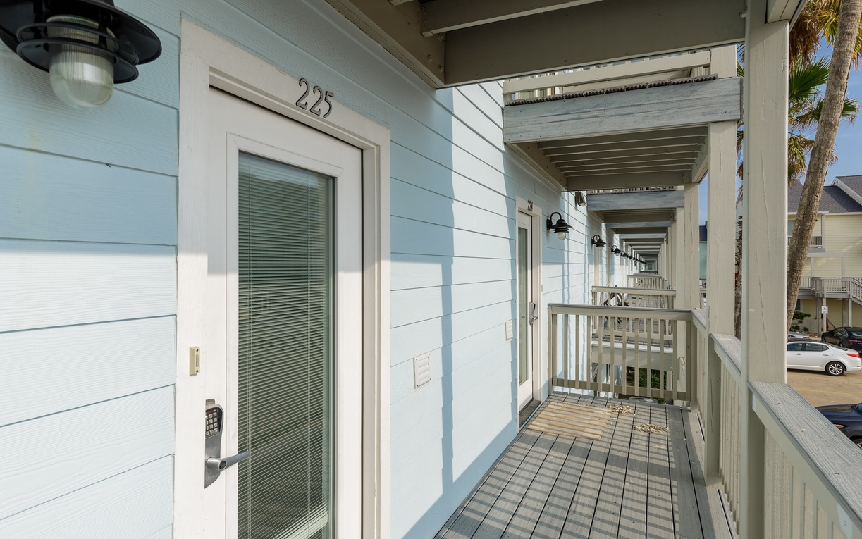 Your coastal retreat awaits behind this charming door, where beach breezes flow through your private covered balcony.