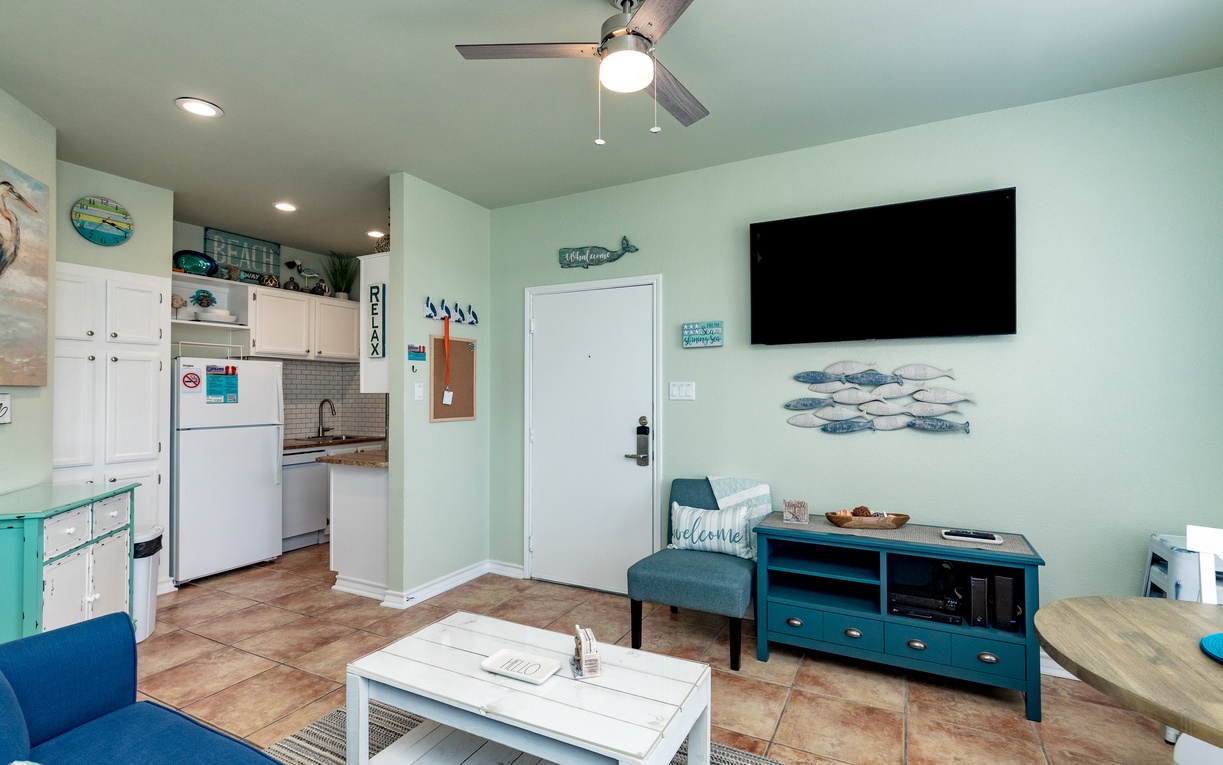 Relax in your coastal-themed retreat with full kitchen, comfortable living area, and beach-inspired decor.