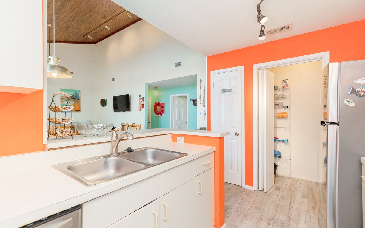 Your vibrant kitchen opens to the living area, creating perfect flow for cooking and socializing together.