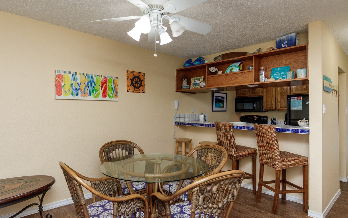 Your bright dining area flows seamlessly into the fully equipped kitchen, perfect for sharing meals and morning coffee together.