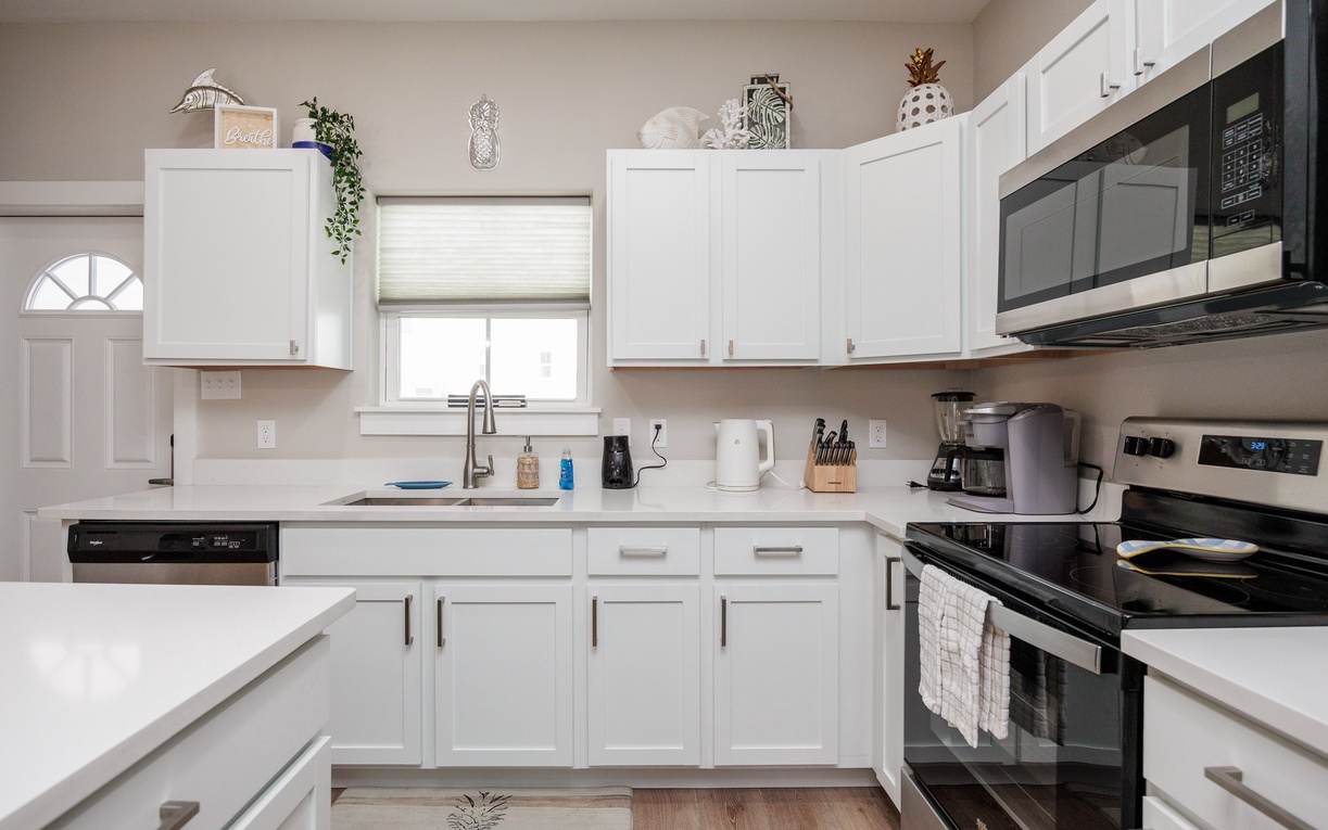 Cook your favorite meals in this bright, fully-equipped kitchen with modern appliances and plenty of counter space for your culinary adventures.