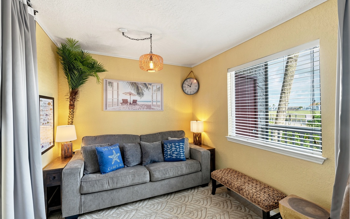 Settle into your cozy retreat, where soft natural light and coastal touches create a warm, inviting space perfect for unwinding after a day of adventure.