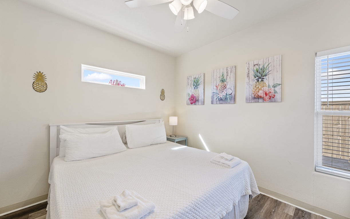 Drift off to peaceful sleep in your bright, airy bedroom with tropical artwork and crisp white linens.