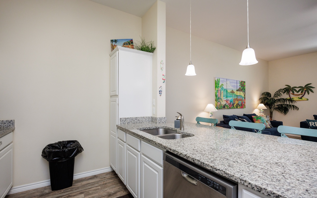 Your bright kitchen features granite counters, stainless appliances, and pendant lighting for memorable meal preparation together.