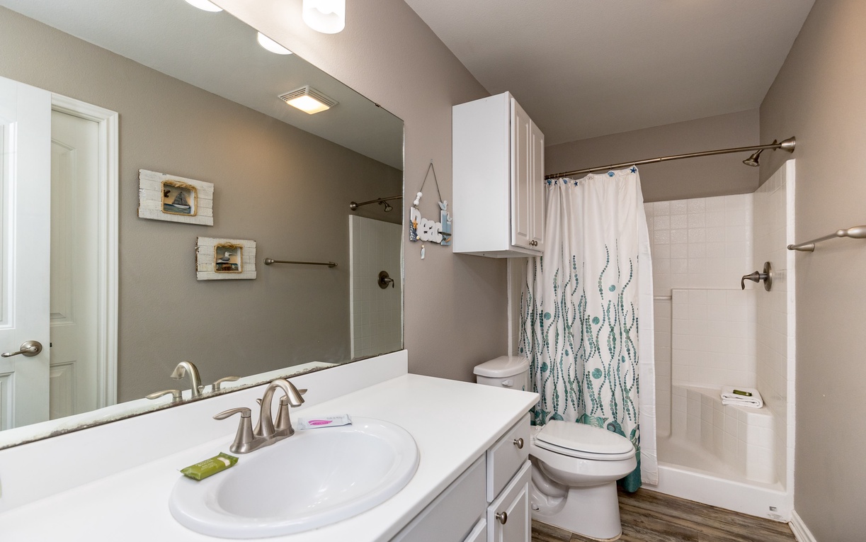 Your private bathroom features a spacious tub-shower combo and ample counter space for your morning routine.