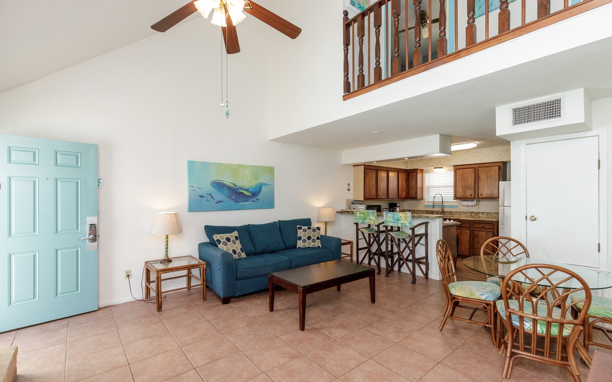 Relax in your spacious open-plan retreat with soaring ceilings, coastal decor, and a fully equipped kitchen perfect for your getaway.