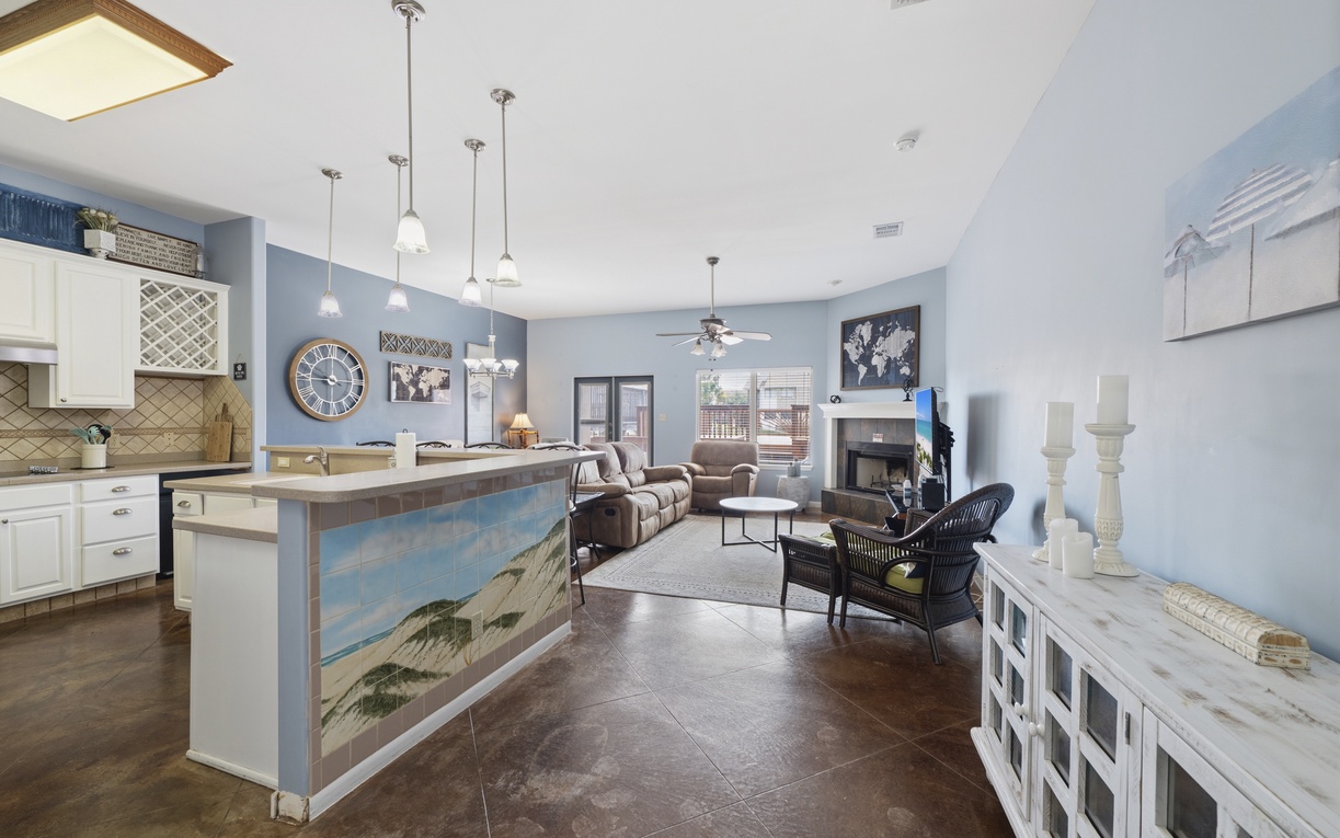 Unwind in this open-concept space where the kitchen flows into your living area, complete with cozy seating to help you feel right at home.