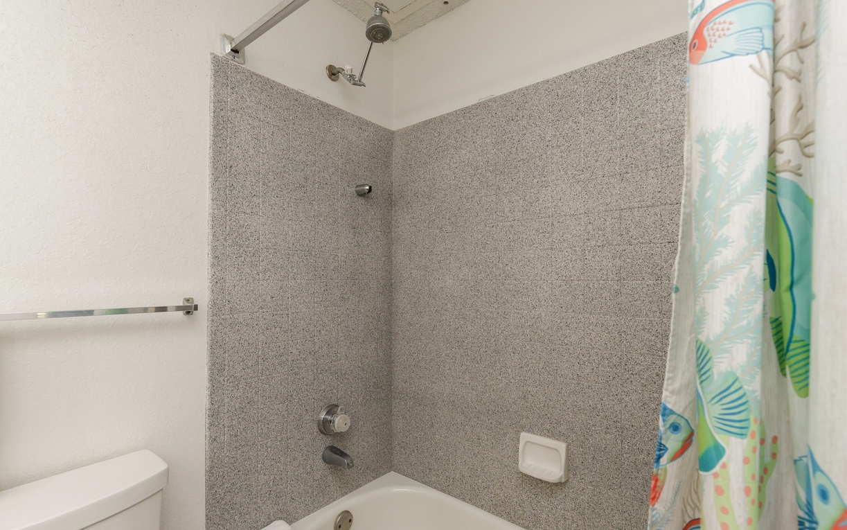 Step into your private spa-like retreat with a spacious tub-shower combo, perfect for unwinding after your adventures.
