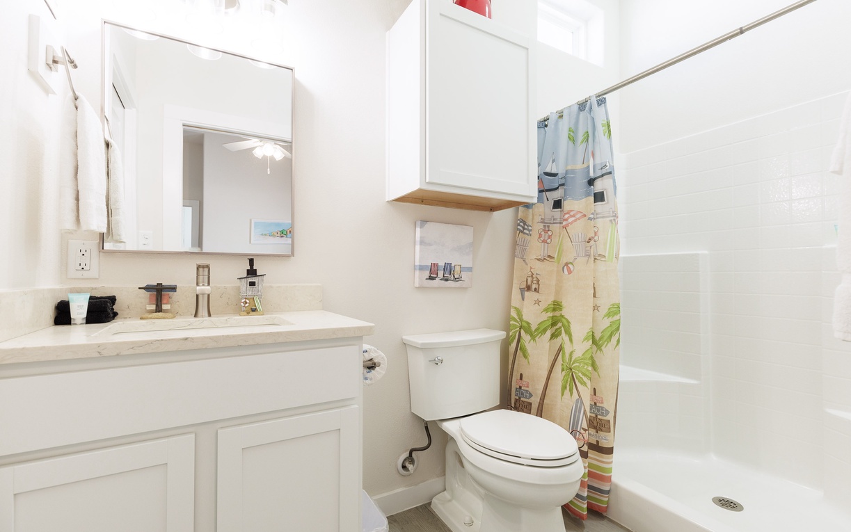 Step into your private bathroom featuring tropical touches and thoughtful amenities for your comfort.