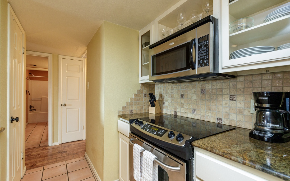 Your fully equipped kitchen awaits with granite counters, stainless appliances, and everything needed to create memorable meals during your stay.