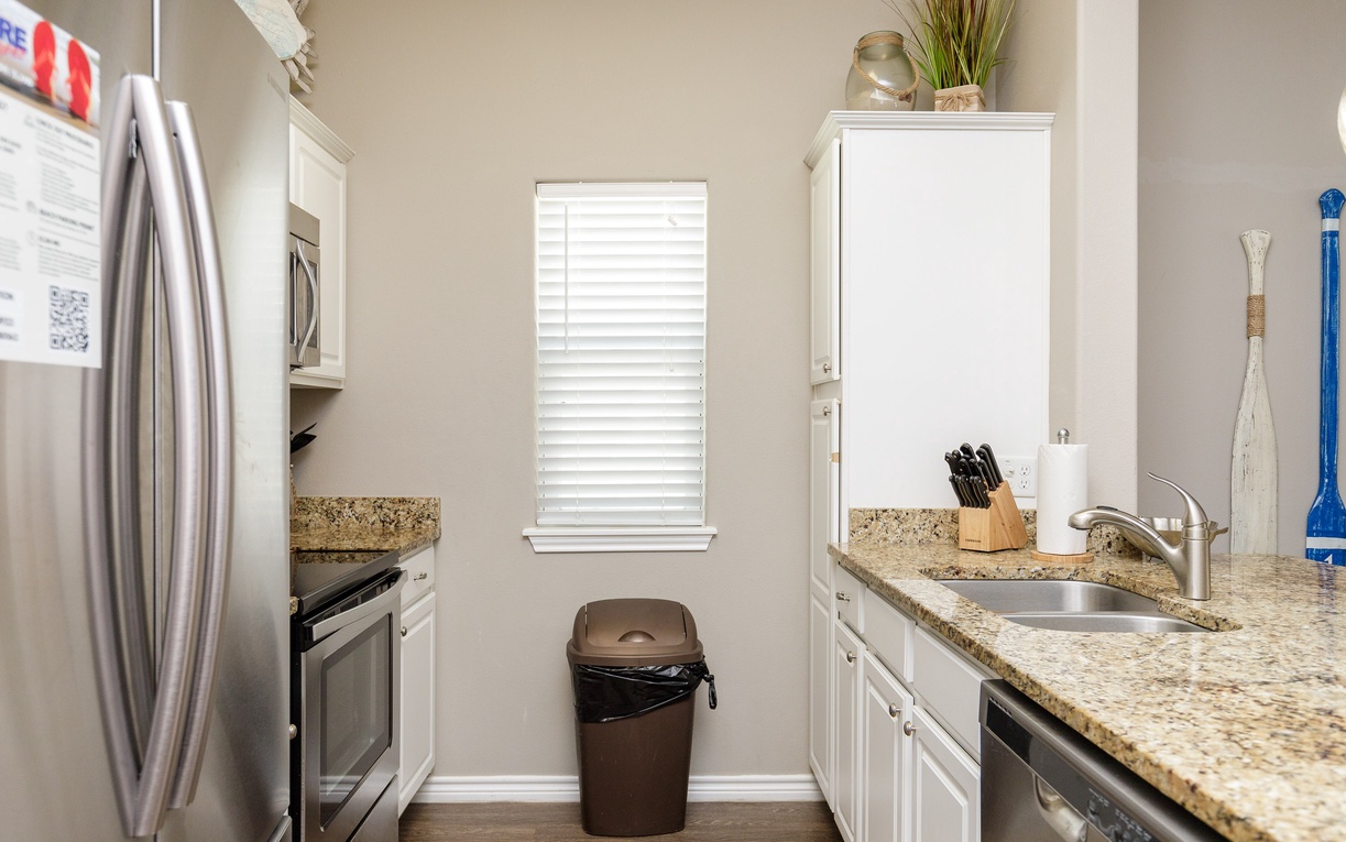 Your fully equipped kitchen awaits with granite countertops, stainless steel appliances, and everything you need to create memorable meals during your stay.