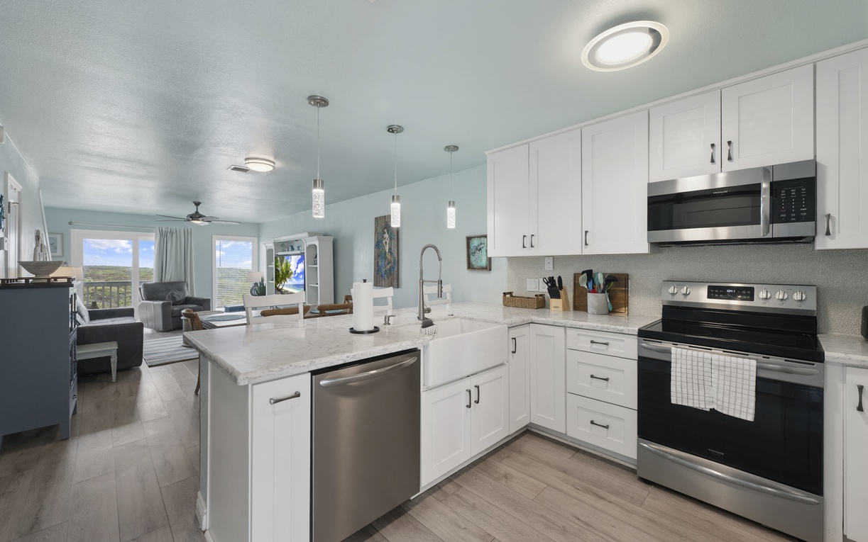 Bright, airy, and designed for together time, with a beautiful marble breakfast bar at the heart of it all.