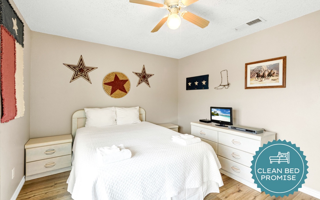 Relax in your cozy bedroom featuring rustic Texas charm with star decorations and comfortable furnishings for peaceful nights.
