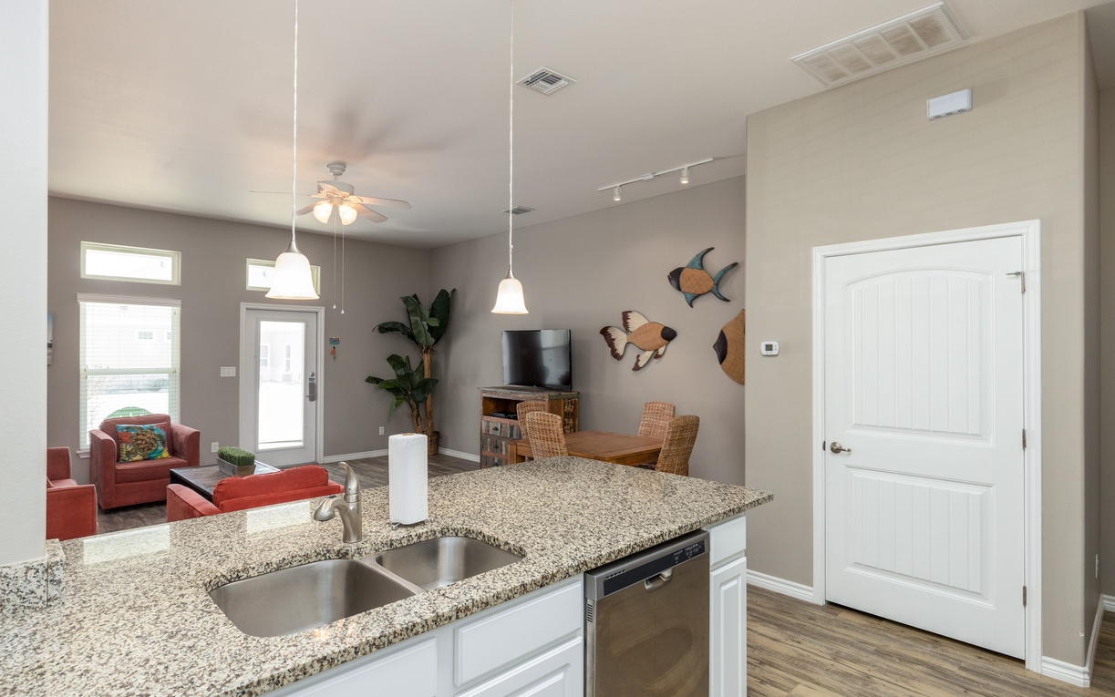 Your open-concept living flows seamlessly from granite kitchen to cozy dining and lounge areas, perfect for gathering and relaxing together.