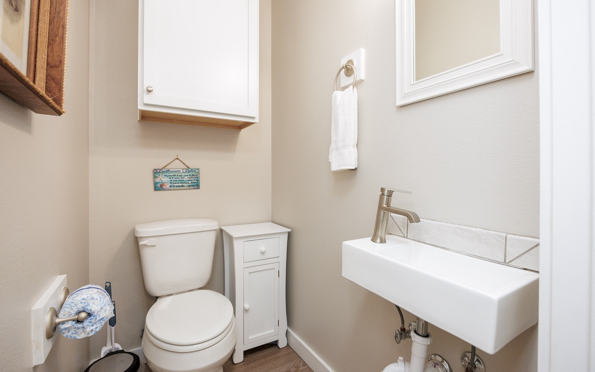 Your private powder room features modern amenities and thoughtful touches for your convenience.
