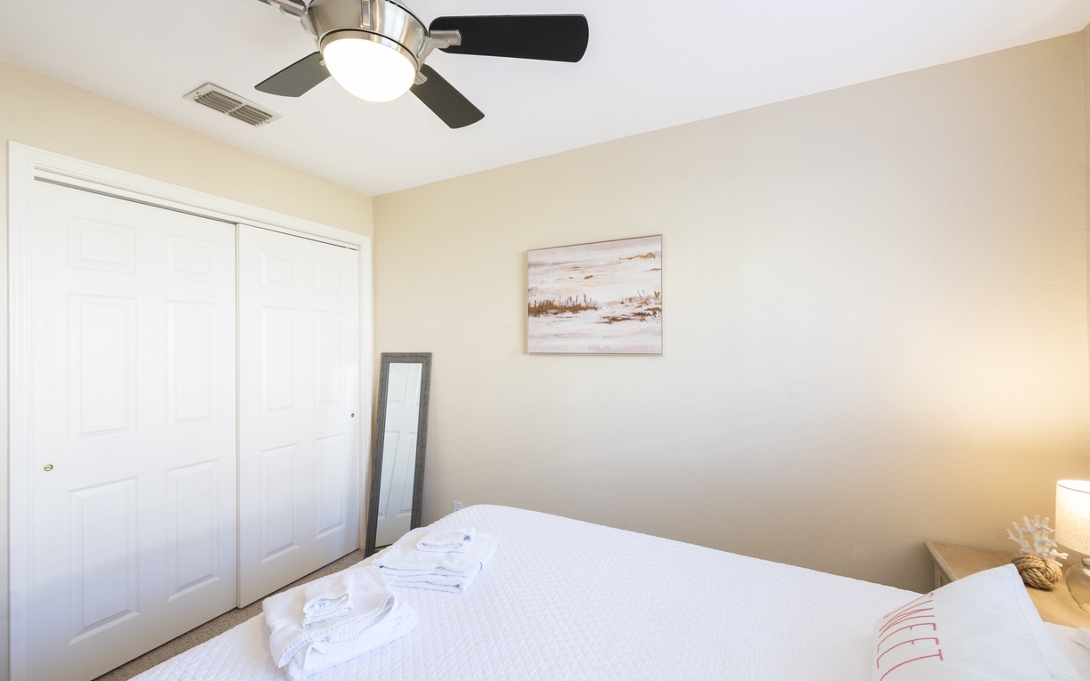 Rest peacefully in your comfortable bedroom with soft linens, gentle ceiling fan, and thoughtful touches for a relaxing stay.