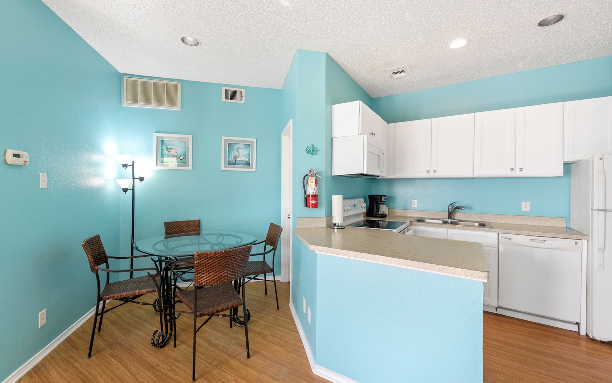 Whip up your favorite meals in this bright coastal kitchen with modern appliances and cheerful dining nook.