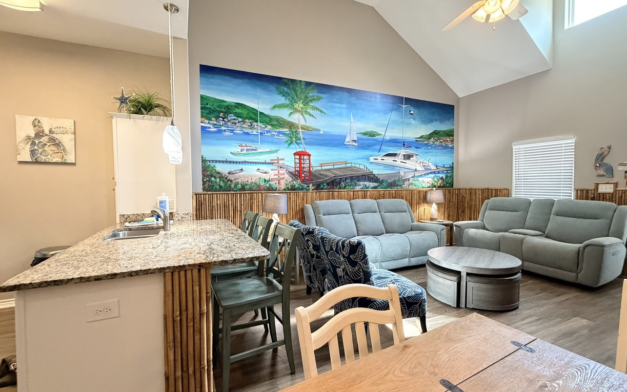 Escape to your tropical haven with soaring ceilings, vibrant ocean murals, and plush seating where you'll unwind after island adventures.