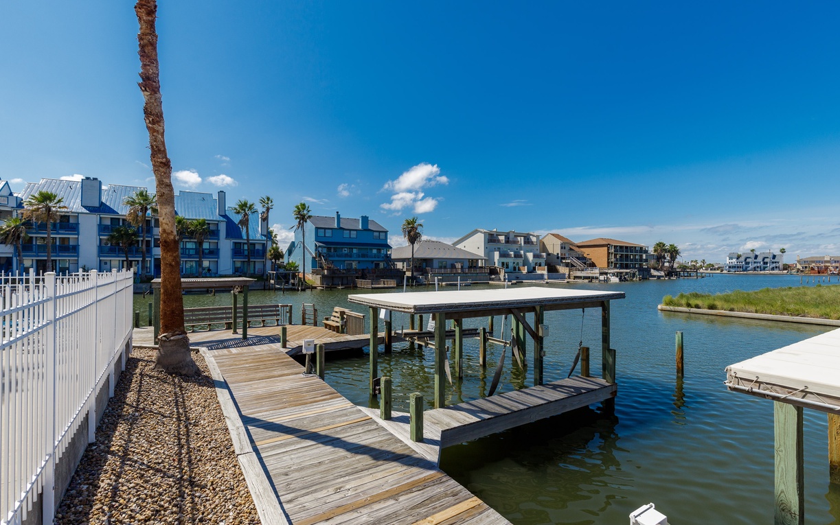 Waterfront setting with private dock access perfect for launching your kayaking adventures or simply enjoying morning coffee by the water.