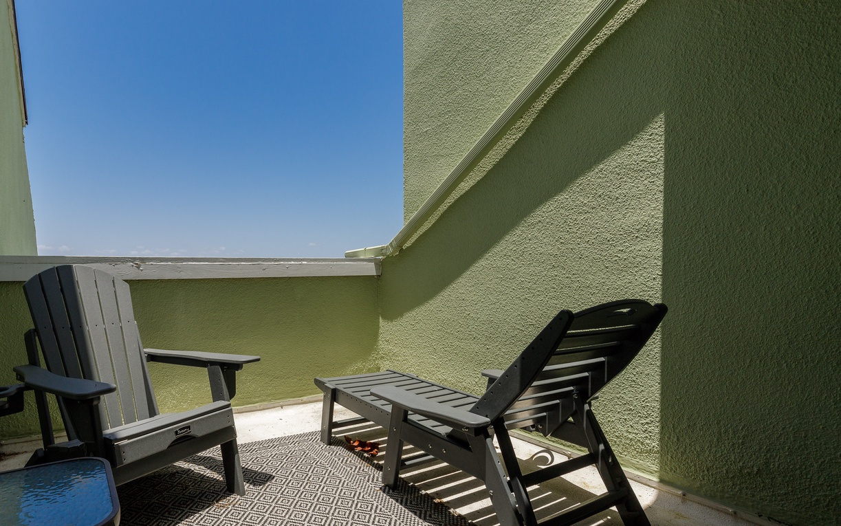 Your private balcony awaits with comfortable seating where you can unwind under the open sky and soak in the peaceful atmosphere.