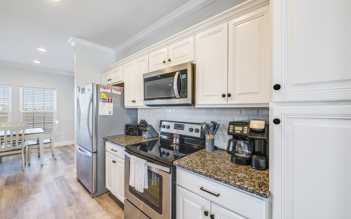 Your fully equipped kitchen awaits with stainless steel appliances, granite countertops, and everything needed to create delicious meals during your stay.