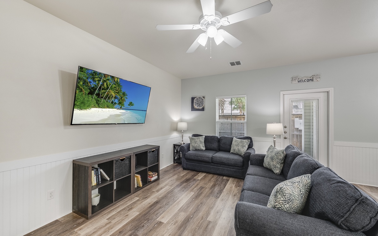 Relax in your spacious living room with plush sectional seating, large TV for movie nights, and modern touches throughout.