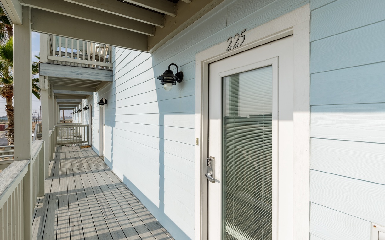 Coastal charm meets modern comfort at your waterfront retreat, complete with private balcony access and serene marina views.
